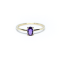 14k gold and oval Amethyst solitaire ring in white background