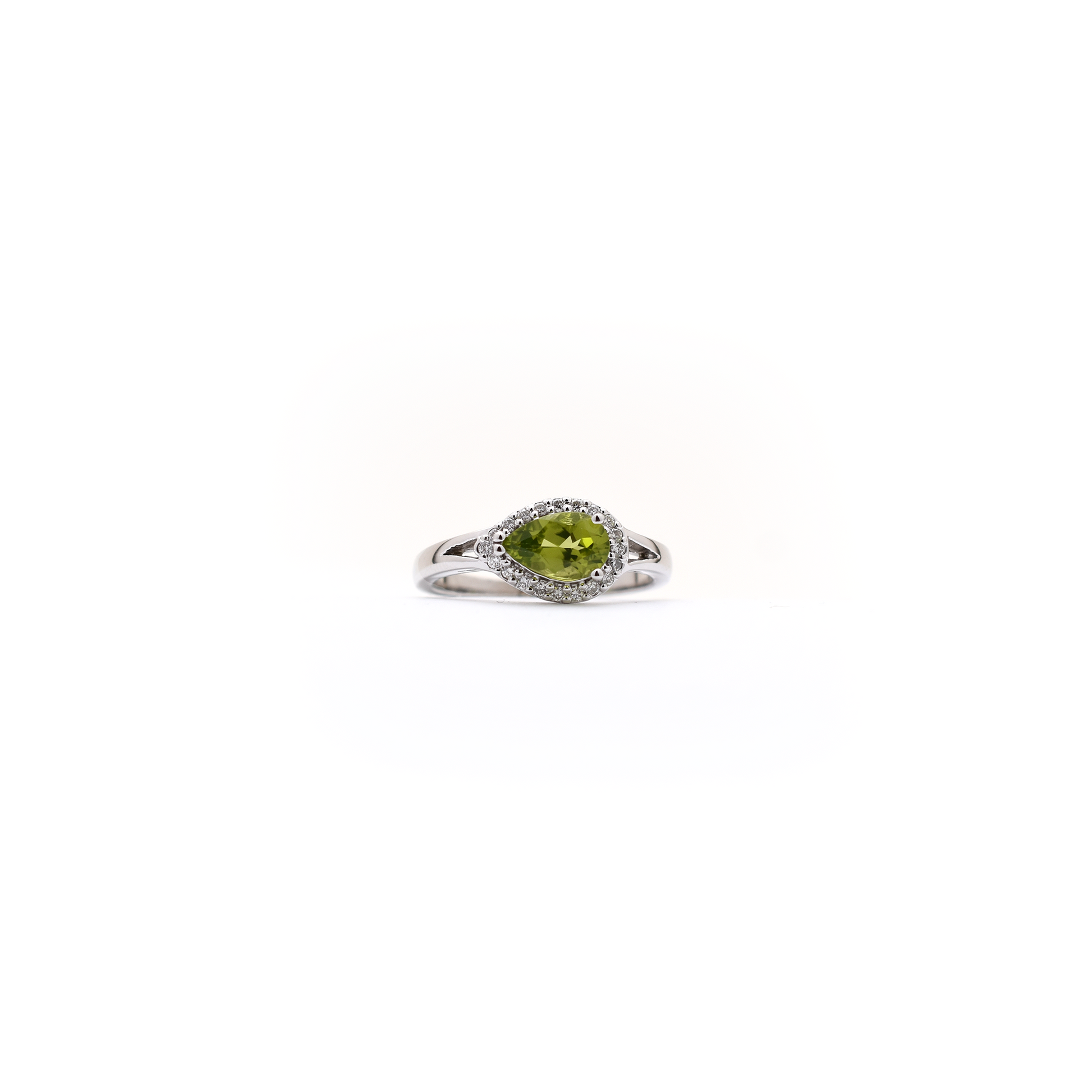 14 k white gold pear shaped peridot and diamond ring