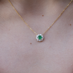 14k yellow gold emerald and diamond halo necklace with green emerald center stone, May birthstone jewelry