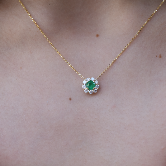 14k yellow gold emerald and diamond halo necklace with green emerald center stone, May birthstone jewelry